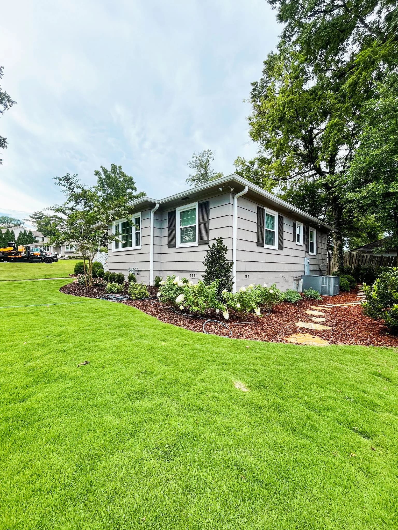 Happy customers with their new landscape